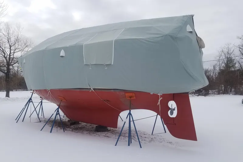 Slide: The Image of 1982 Bristol 38.8 boat in winter storage, covered in snow. - 49