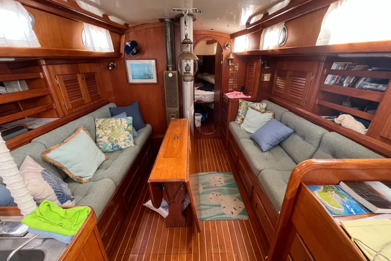 Slide: The Image of Interior of a 1982 Bristol 38.8 yacht with cozy seating areas. - 5