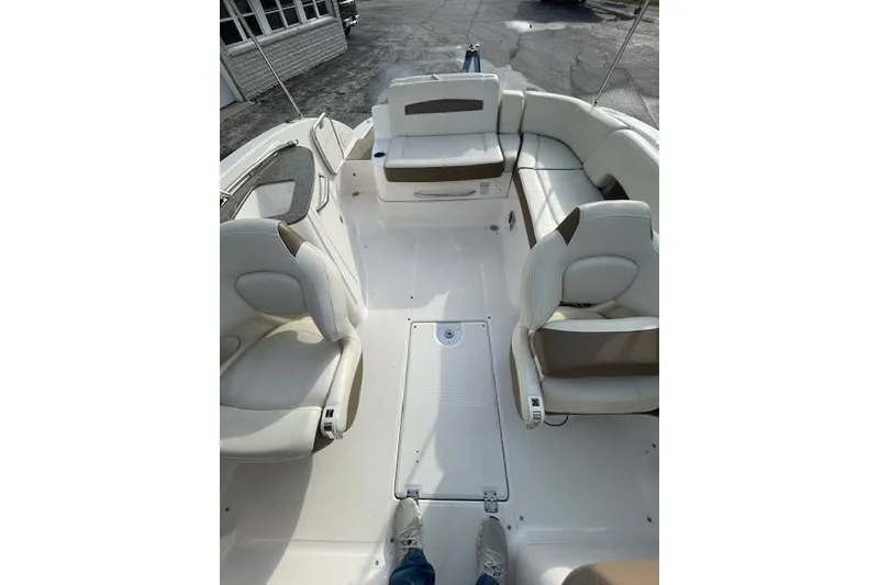 Slide: The Image of 2014 Chaparral 244 Sunesta boat interior with white seating and spacious layout. - 6