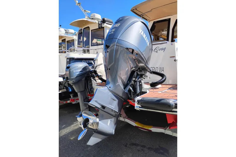 Slide: The Image of 2023 Ranger Tugs R-25 with Yamaha outboard motor, docked and ready for adventure. - 13