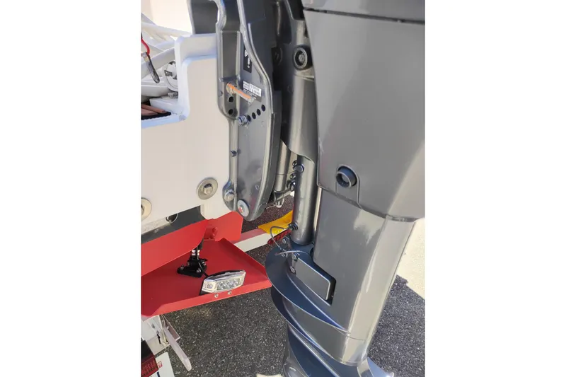 Slide: The Image of Close-up of 2023 Ranger Tugs R-25 outboard motor and mounting details. - 14