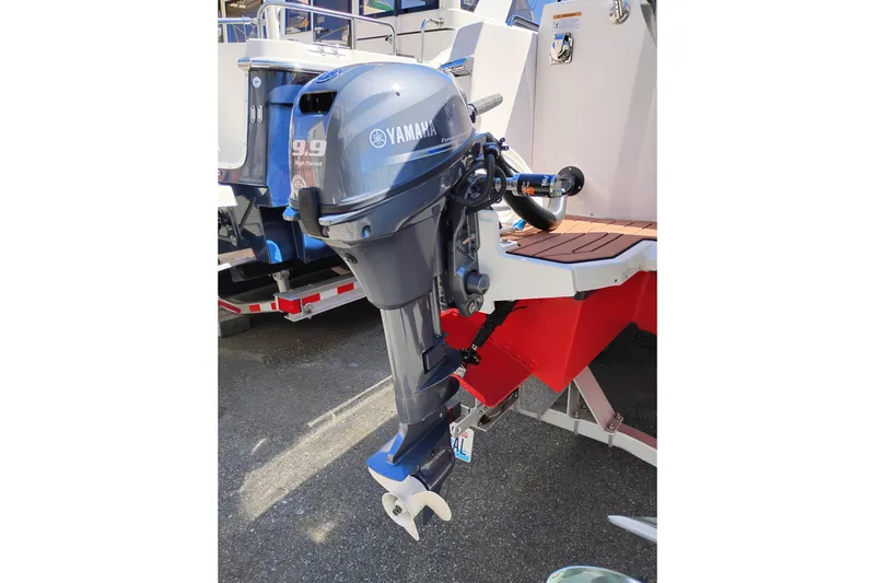 Slide: The Image of Yamaha outboard motor on 2023 Ranger Tugs R-25 boat, docked on a trailer. - 16