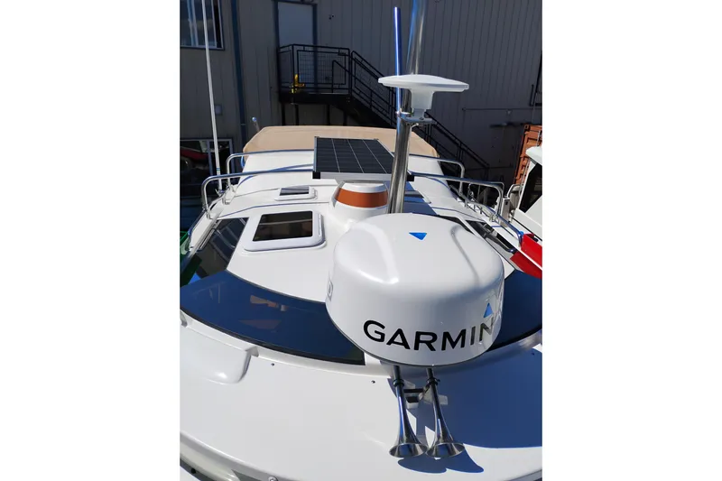 Slide: The Image of 2023 Ranger Tugs R-25 boat with Garmin radar and solar panel on deck. - 19