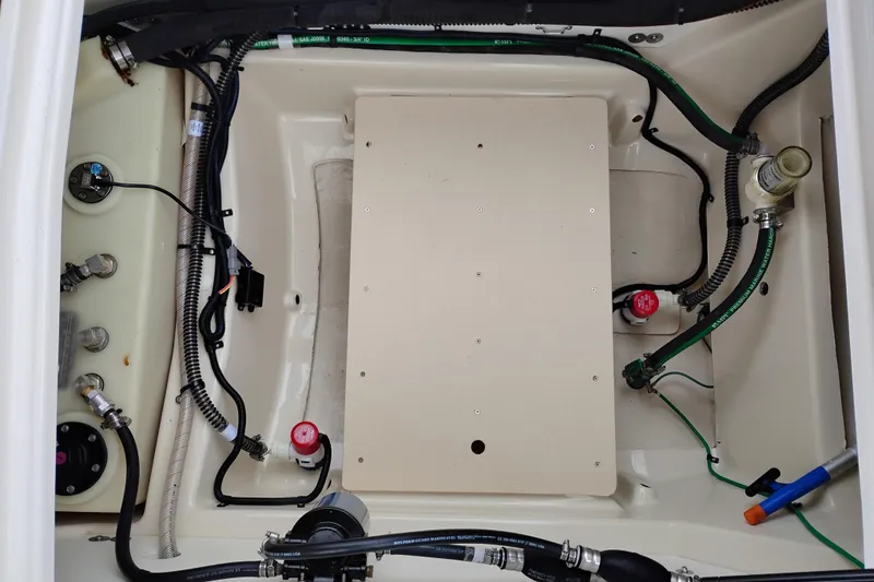 Slide: The Image of Engine compartment of 2023 Ranger Tugs R-25 boat, showcasing wiring and components. - 28