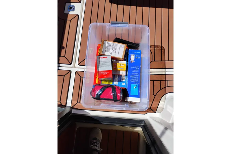 Slide: The Image of Storage box with supplies on 2023 Ranger Tugs R-25 boat deck. - 29