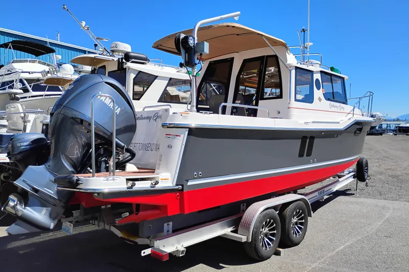 Slide: The Image of 2023 Ranger Tugs R-25 boat on trailer with Yamaha outboard motor. - 3