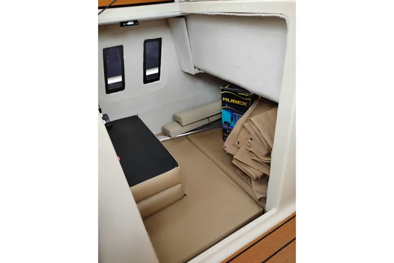 Slide: The Image of Interior cabin of 2023 Ranger Tugs R-25 boat with seating and storage. - 37