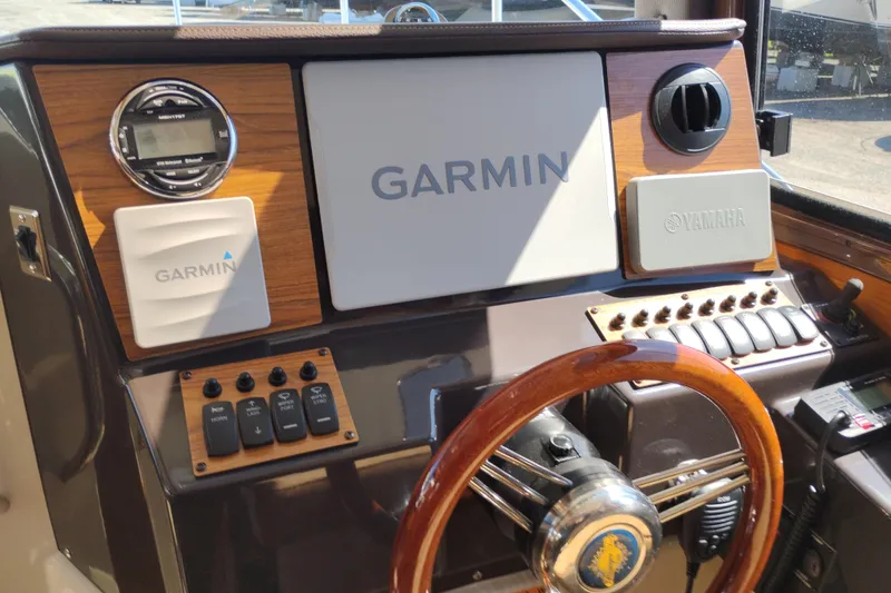 Slide: The Image of 2023 Ranger Tugs R-25 helm with Garmin and Yamaha controls. - 47