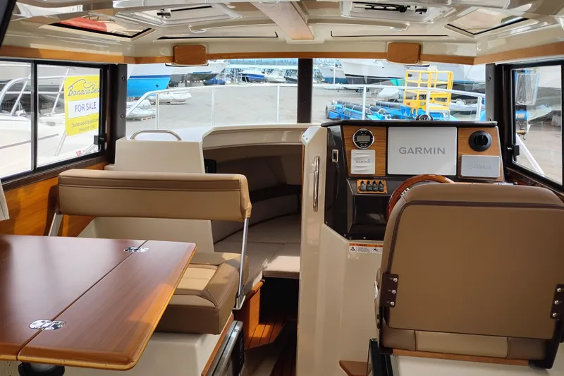Slide: The Image of Interior of 2023 Ranger Tugs R-25 boat with Garmin navigation system. - 49