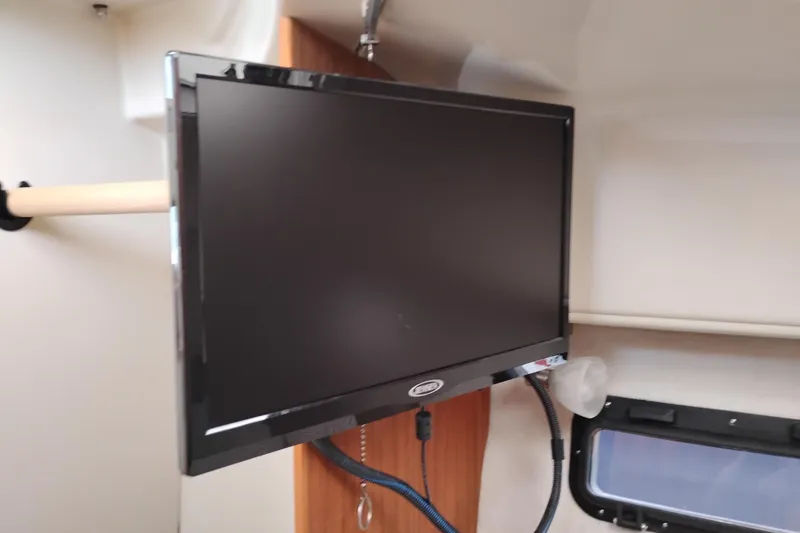 Slide: The Image of Compact bathroom in 2023 Ranger Tugs R-25 boat with sink and toilet. - 57