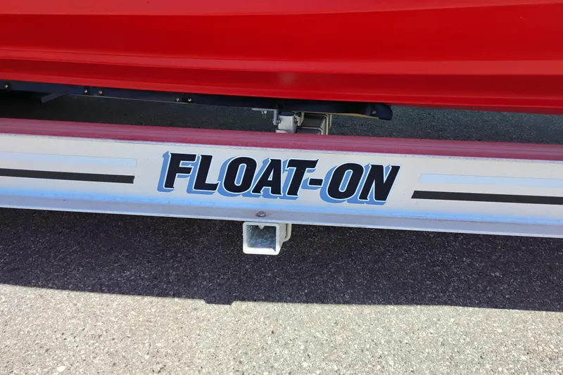 Slide: The Image of Trailer with "FLOAT-ON" text for 2023 Ranger Tugs R-25 boat. - 9