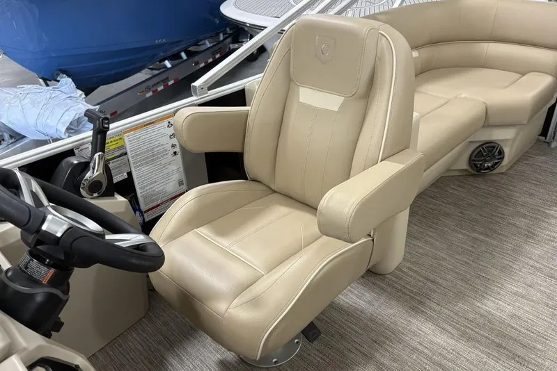 Slide: The Image of Captain's chair and helm of 2026 Godfrey XPERIENCE 2086 pontoon boat interior. - 14