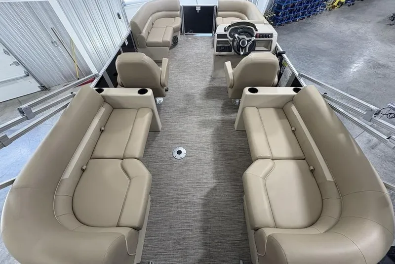 Slide: The Image of Interior of 2026 Godfrey XPERIENCE 2086 pontoon boat with beige seating and steering console. - 15