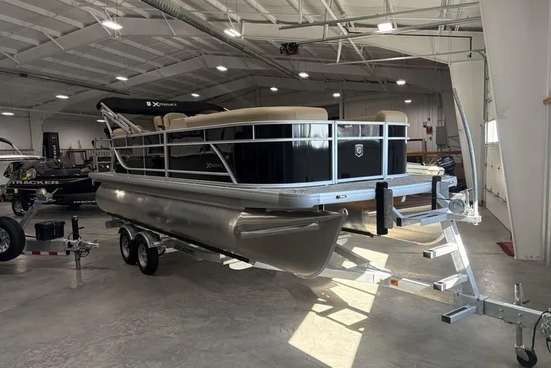 Slide: The Image of 2026 Godfrey XPERIENCE 2086 pontoon boat on trailer in indoor showroom. - 2
