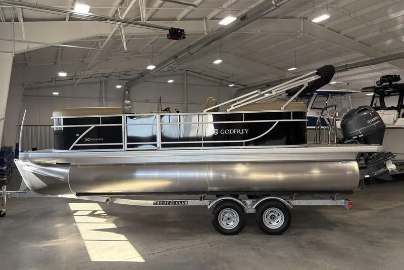 Slide: The Image of 2026 Godfrey XPERIENCE 2086 pontoon boat in showroom, on trailer. - 4