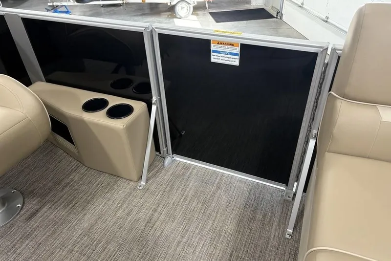 Slide: The Image of Interior of 2026 Godfrey XPERIENCE 2086 boat with beige seating and cup holders. - 6