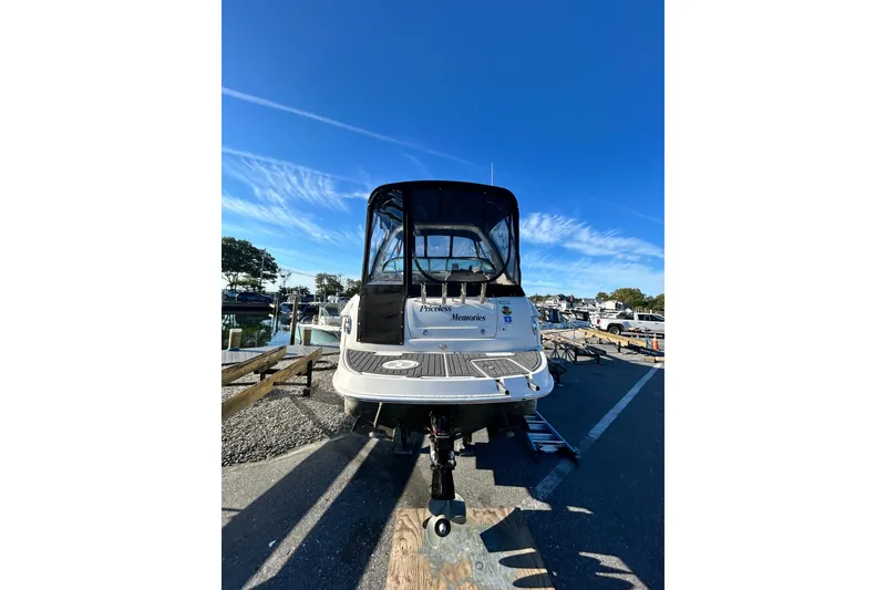 Slide: The Image of 2006 Monterey 270 Cruiser boat on trailer under clear blue sky. - 2