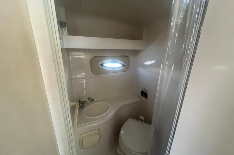 Slide: The Image of 2006 Monterey 270 Cruiser bathroom with sink, toilet, and small window. - 29