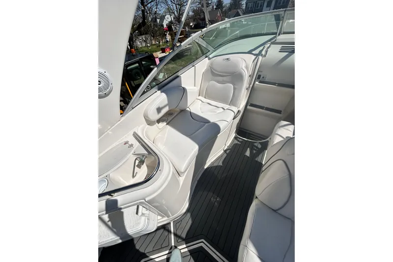 Slide: The Image of 2006 Monterey 270 Cruiser interior with white seating and sleek design. - 6