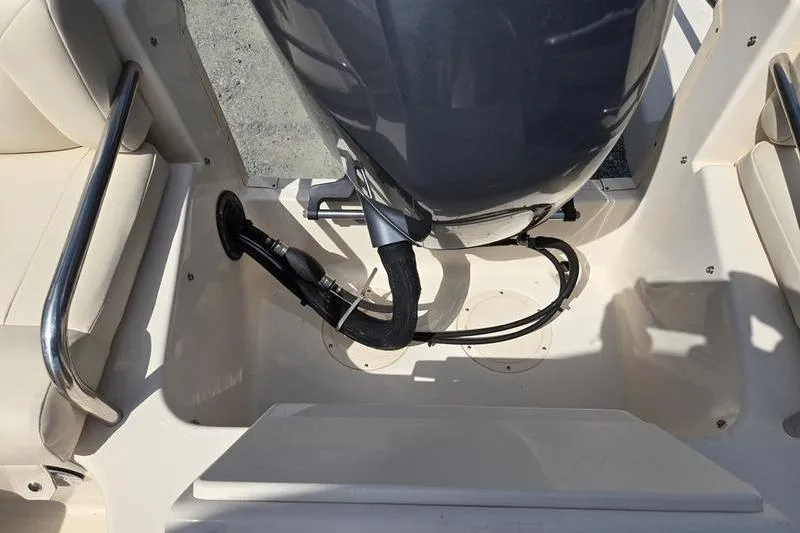 Slide: The Image of 2015 Grady-White Freedom 205 boat engine area with seating and railing. - 17