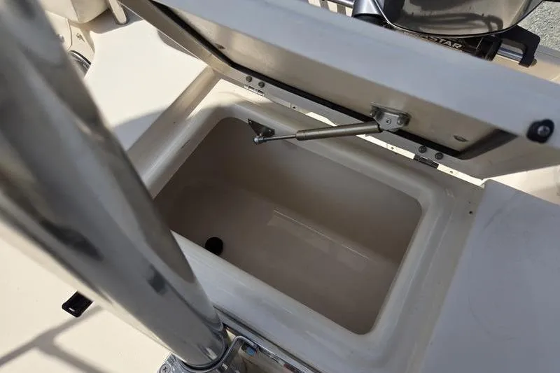 Slide: The Image of Open storage compartment on a 2015 Grady-White Freedom 205 boat. - 24