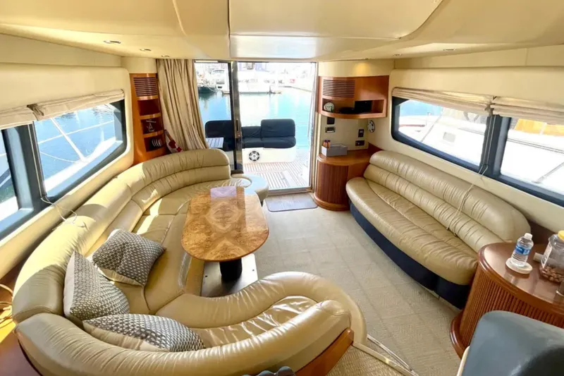Slide: The Image of Luxurious interior of a 2004 Azimut 46 yacht with elegant leather seating and wooden accents. - 13