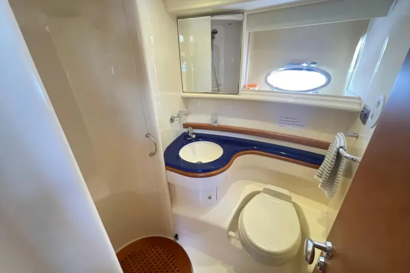 Slide: The Image of Luxurious 2004 Azimut 46 yacht bathroom with modern fixtures and elegant design. - 19