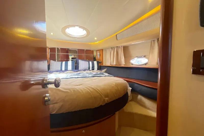Slide: The Image of Luxurious cabin interior of a 2004 Azimut 46 yacht with cozy bedding. - 21