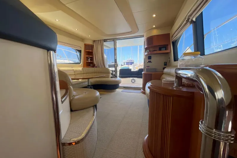 Slide: The Image of Luxurious interior of a 2004 Azimut 46 yacht with elegant seating and large windows. - 23