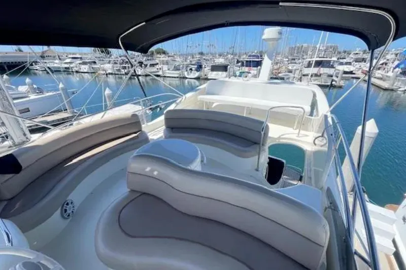 Slide: The Image of Luxurious 2004 Azimut 46 yacht with spacious seating at marina. - 25