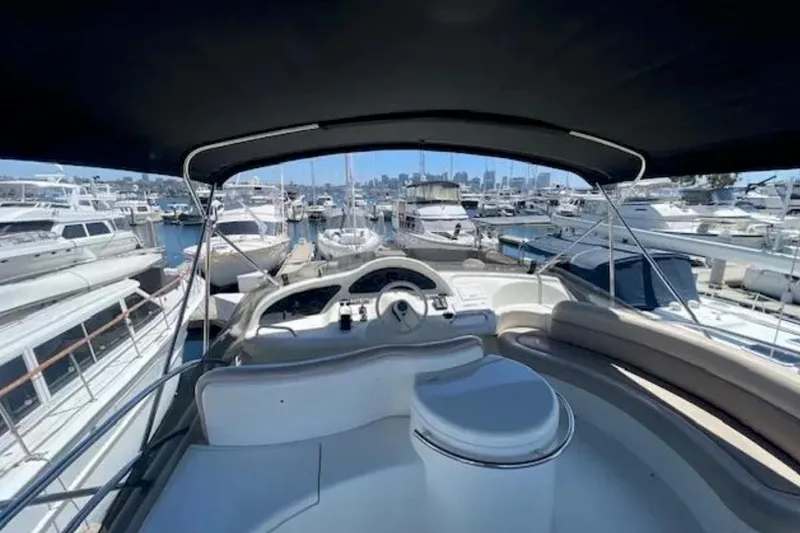 Slide: The Image of Cockpit view of 2004 Azimut 46 yacht docked in a marina. - 26