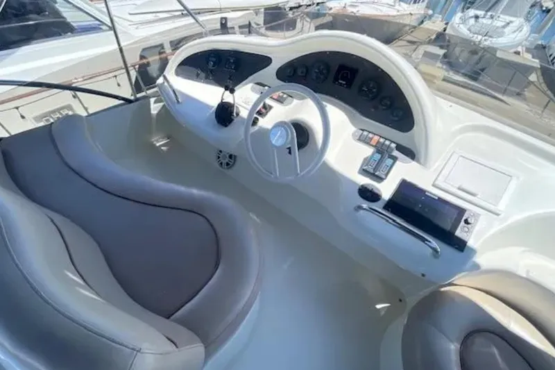 Slide: The Image of Cockpit of 2004 Azimut 46 yacht with steering wheel and control panel. - 29
