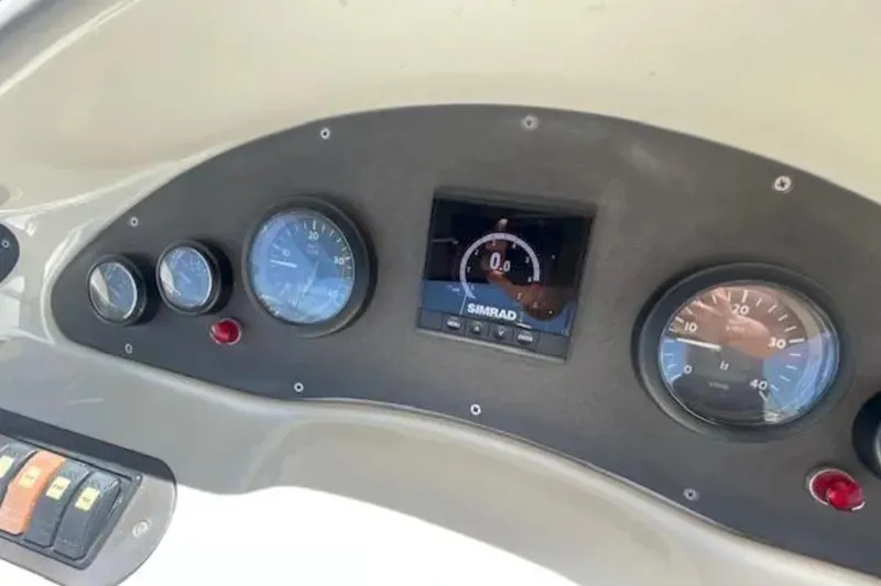 Slide: The Image of Dashboard of a 2004 Azimut 46 yacht with gauges and Simrad display. - 33