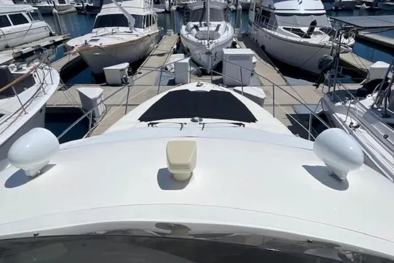 Slide: The Image of 2004 Azimut 46 yacht docked among other boats in a marina. - 34