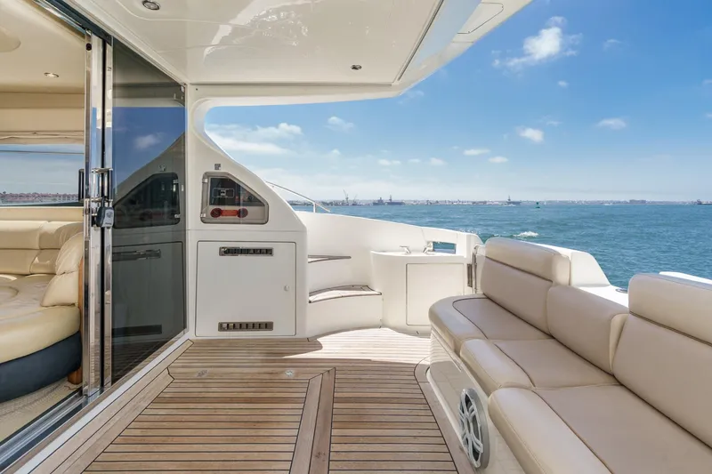 Slide: The Image of Luxurious 2004 Azimut 46 yacht deck with elegant seating and ocean view. - 36