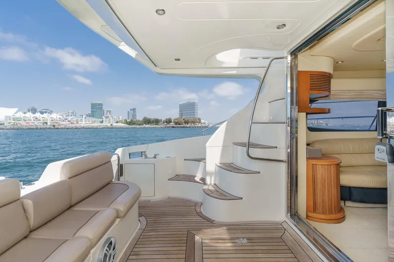 Slide: The Image of Luxurious 2004 Azimut 46 yacht interior with elegant seating and scenic waterfront view. - 37