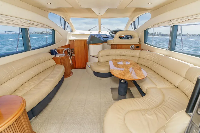 Slide: The Image of Luxurious interior of a 2004 Azimut 46 yacht with elegant seating and panoramic windows. - 39