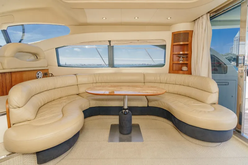 Slide: The Image of Luxurious interior of a 2004 Azimut 46 yacht with plush seating and panoramic windows. - 41
