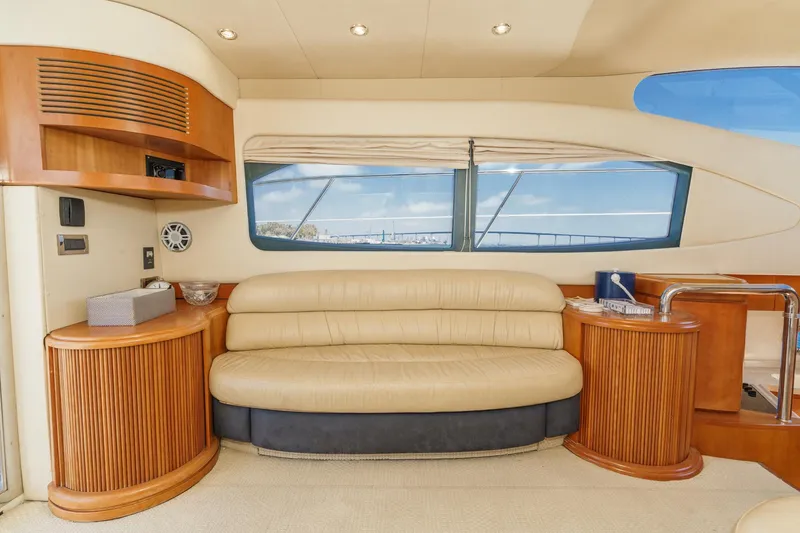 Slide: The Image of Luxurious interior of a 2004 Azimut 46 yacht with beige leather seating and wooden accents. - 43