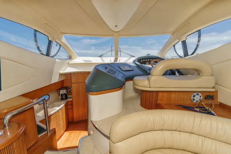 Slide: The Image of Luxurious interior of a 2004 Azimut 46 yacht with elegant wood and leather finishes. - 46