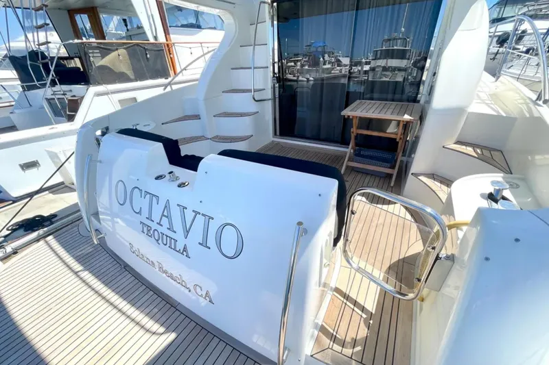 Slide: The Image of 2004 Azimut 46 yacht deck with seating and stairs, docked at marina. - 5