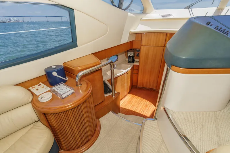 Slide: The Image of Luxurious interior of 2004 Azimut 46 yacht with wooden cabinetry and ocean view. - 51