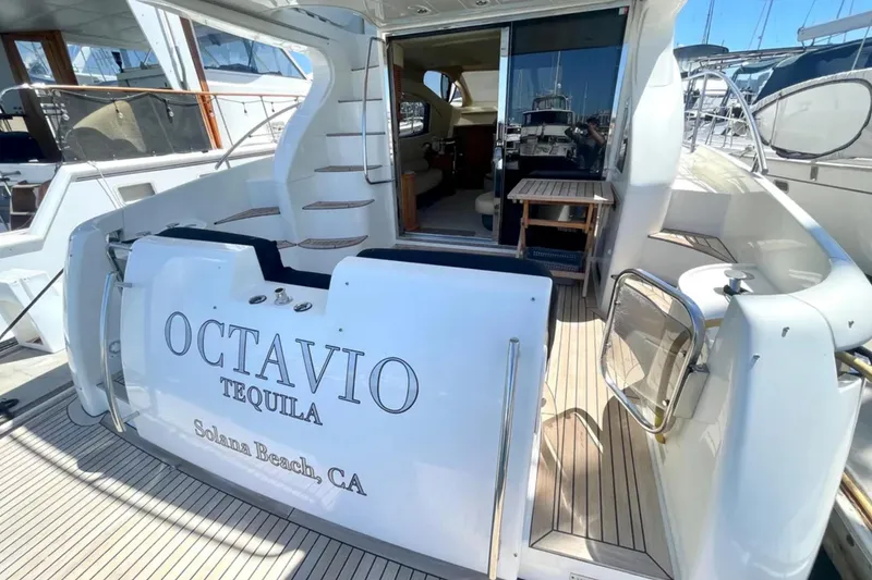 Slide: The Image of 2004 Azimut 46 yacht with "Octavio Tequila" branding, docked at Solana Beach, CA. - 6