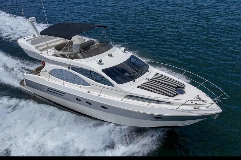Slide: The Image of Bathroom interior of 2004 Azimut 46 yacht with porthole and wooden cabinets. - 63