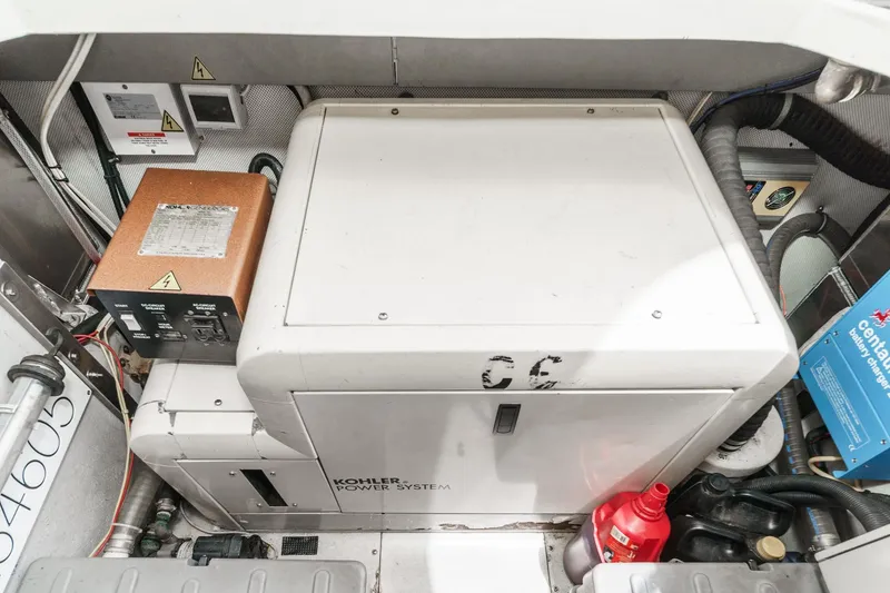 Slide: The Image of Engine room of 2004 Azimut 46 yacht featuring Kohler power system and equipment. - 71