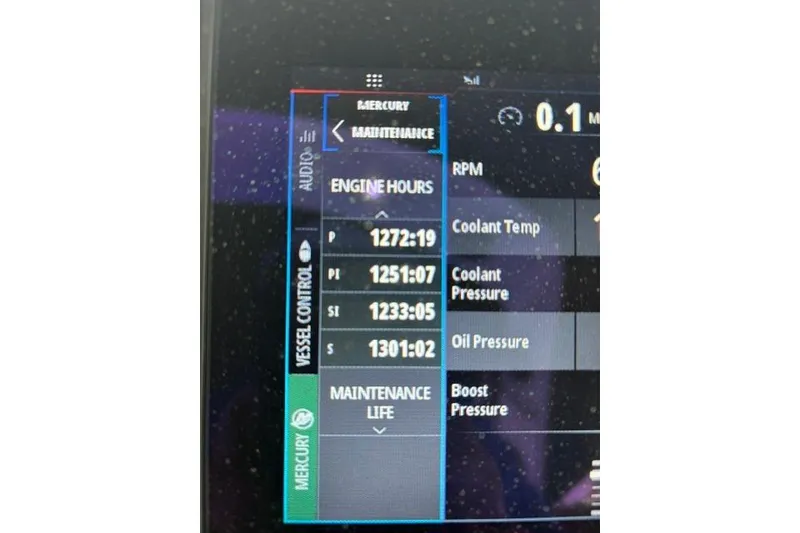 Slide: The Image of Dashboard display showing engine hours and maintenance data for a 1999 Formula 400 Super Sport. - 10