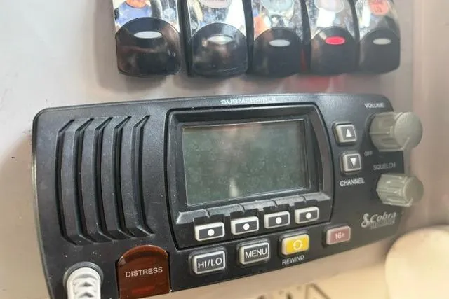 Slide: The Image of Cobra marine radio on 1999 Formula 400 Super Sport boat dashboard. - 11