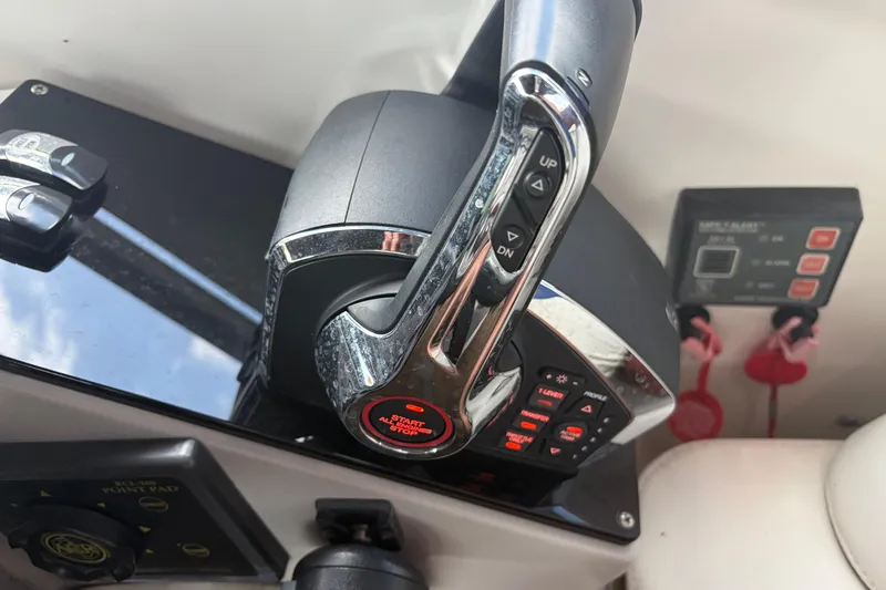 Slide: The Image of Control panel of a 1999 Formula 400 Super Sport boat with start/stop button. - 12