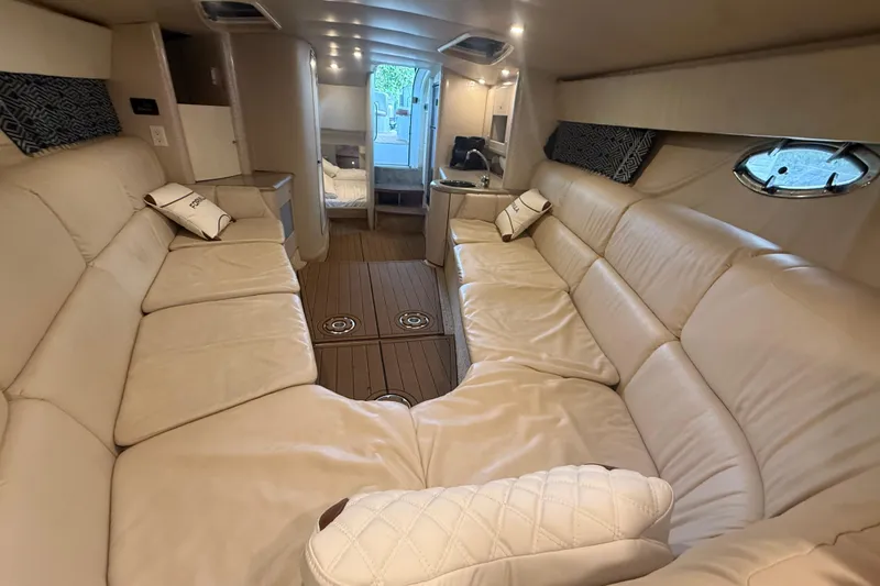 Slide: The Image of Luxurious interior of a 1999 Formula 400 Super Sport yacht with beige leather seating. - 14