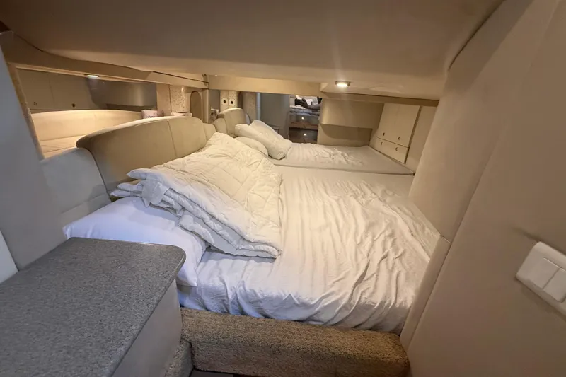 Slide: The Image of Interior cabin of a 1999 Formula 400 Super Sport boat with cozy bedding. - 16